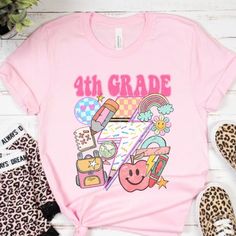 PLEASE READ ENTIRE DESCRIPTION BEFORE ORDERING Unisex Fit Fourth Grade Shirt, 4th Grade Shirt, 4th Grade Team, Cute 4th grade tee, Hello 4th grade, Back to school shirts, First Day Fall in love with this soft and cozy Graphic Tee, Sweatshirt or hoodie  TO MAKE YOUR SHOPPING EXPERIENCE EASIER, YOU CAN "CHOOSE" A T SHIRT, SWEATSHIRT OR HOODIE IN THIS LISTING. Size up 1-2 sizes for a slouchy oversized fit PINK, Sand and light blue are NOT available in a 4X 5X Sweatshirt but they ARE  available in T Fun Pink T-shirt For School Events, Back To School T-shirt With Heat Transfer Vinyl, School Spirit Tops With Screen Print, School Spirit Screen Print Tops, Casual School Shirt With Character Print, College Shirt With Graphic Print In Pink, College Graphic Print Pink Shirt, Pink Short Sleeve T-shirt For School Events, Pink Graphic Print Shirt For College