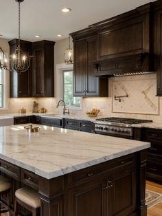 a large kitchen with marble counter tops and dark wood cabinets, along with an island in the middle