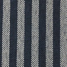 black and white striped fabric textured with dark blue pinstripe pattern, closeup