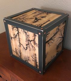 a wooden box sitting on top of a table