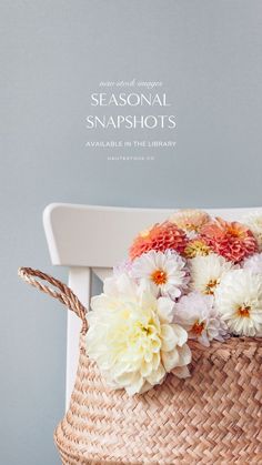 a basket filled with flowers sitting on top of a white chair