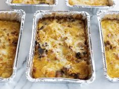 six pans filled with different types of food