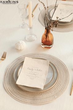 a table set with place settings and napkins