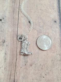 "This listing is for a hand-stamped initial necklace featuring a 4/5\" x 3/5\" silver plated cowboy boots charm & 3/10\" stainless steel initial pendant. The silver plated chain is 18\" long, but can be made to your desired length- see last photo in listing. Please indicate the chain length you would like in the 'notes to seller' section at checkout. All items are lead & nickel free. Message me with any questions, thank you! Add an initial to any necklace: https://www.etsy.com/listing/17 Rodeo Jewelry, Western Gifts, Boot Jewelry, Western Jewelry, Initial Pendant, Initial Necklace, Chain Lengths, Cowboy Boots, Hand Stamped