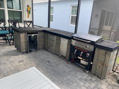 an outdoor kitchen made out of pallet wood