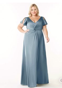 a woman in a blue dress with her hands on her hips