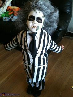 a child dressed in a costume for halloween