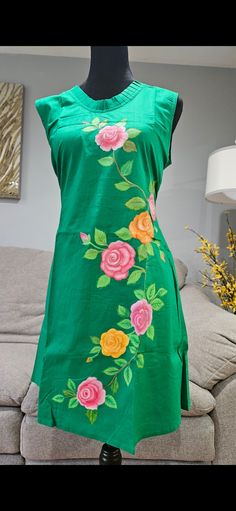 Adorned in a stunning hand-painted green dress, embellished with beautifulflowers. This dress exudes elegance and charm, perfect for any occasion Elegant Green Dress With Floral Applique, Elegant Green Dress With Floral Embroidery, Traditional Green Sleeveless Dress, Green Floral Applique Dress For Summer, Green Floral Applique Summer Dress, Green Floral Embellished Summer Dress, Green Floral Dresses For Summer, Green Floral Print Embroidered Dress For Spring, Green Embroidered Floral Dress For Spring