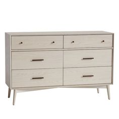 a white dresser with six drawers and two handles