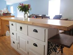 a kitchen island made out of an old dresser