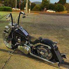 a black motorcycle parked on the side of a road