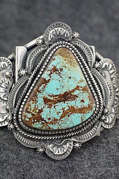 This substantial and beautiful Number 8 turquoise and sterling silver bracelet was made by Navajo silversmith Hank Vandever. The inside of the cuff is signed HV and stamped sterling.Size: 5 1/4" (will fit up to a 6 1/4" wrist)Gap: 1"Width: 2 3/8"Cuff Width: 5/8"Free shipping on all orders! We ship with USPS and always include tracking. All orders ship within a day of payment.Returns are accepted up to 30 days after you receive your order. Just send us a message. Our shop offers cash back or stor Silver Western Cuff Bracelet With Patina, Turquoise Stone Jewelry, Native American Jewellery, Tree Jewelry, Turquoise Jewelry Native American, Number 8, Jewelry Tree, Sterling Silver Bracelet, Native American Jewelry