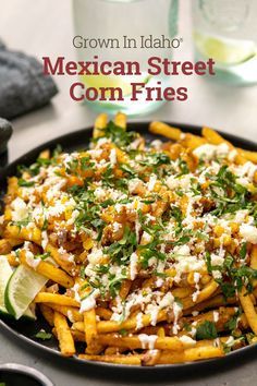 mexican street corn fries with cilantro and parmesan cheese in a skillet