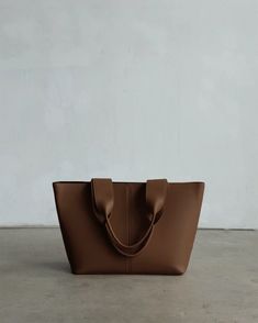 Lafayette Tote Pecan – Freja New York Elegant Brown Bucket Bag With Rolled Handles, Chic Bucket Hobo Bag With Rolled Handles, Modern Rectangular Shoulder Bag With Rolled Handles, Brown Hobo Bag With Rolled Top Handles, Brown Bucket Bag With Rolled Handles For Shopping, Modern Solid Color Hobo Bag With Double Handle, Modern Solid Color Double Handle Hobo Bag, Modern Double Handle Hobo Bag, Elegant Brown Shoulder Bag With Rolled Handles