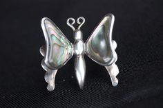 "add a little flutter to your style Very pretty Vintage Sterling Silver and inlaid Abalone Butterfly Brooch which comes with matching screwback Earrings. The Brooch measures: 1-1/4\" High and 1-1/4\" in Width The Earrings measure: 3/4\" X 3/4\" and are screwback. Stamped Sterling 925 Mexico RHI on brooch Very Good condition." Silver Butterfly Pins For Gift, Butterfly Brooch, Screw Back Earrings, Vintage Sterling Silver, Earring Set, Jewelry Sets, Drop Earrings, Sterling Silver, Silver