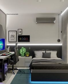 a bed room with a neatly made bed next to a desk and computer monitor on top of it