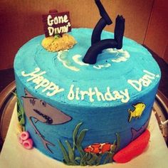 a birthday cake that is decorated with an image of a person diving into the water