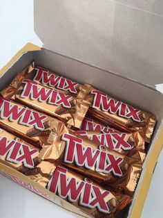 a box of twx chocolates sitting on top of a table