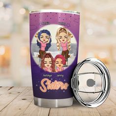 a purple tumbler with the name sisters on it next to a metal cup holder