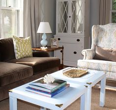 a living room filled with furniture and a white coffee table