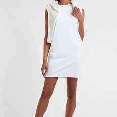 This Mini Dress Is Ready For Anything Thanks To Soft, Lightweight T-Shirt Fabric, Chic Padded Shoulders And A Comfy Shift Fit. Crew Neck Padded Shoulders; Cap Sleeves Straight Hem Mini Length 36.5" Long Cotton White Chic Crew Neck Mini Dress, Stretch Cotton Crew Neck Mini Dress, Stretch Cotton Dresses With Crew Neck, Stretch Cotton Crew Neck Dresses, Cotton Stretch Dresses With Crew Neck, White Cotton T-shirt Dress With Crew Neck, White Crew Neck T-shirt Dress For Spring, White Cotton Crew Neck T-shirt Dress, White Crew Neck Mini Dress For Summer