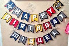 a birthday banner is hanging on the wall