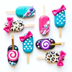 colorful lollipops with bows and leopard print on them