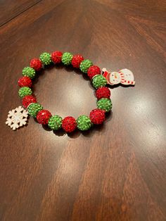 Red and Green bracelet  Christmas bracelet  Stretch Bracelet Christmas Beaded Stretch Bracelet Gift, Holiday Festive Jewelry Bracelet, Festive Beaded Holiday Jewelry, Christmas Holiday Green Jewelry, Green Christmas Holiday Jewelry, Adjustable Beaded Stretch Bracelet For Christmas, Festive Round Christmas Jewelry, Christmas Holiday Bracelet Jewelry, Christmas Holiday Jewelry Bracelet