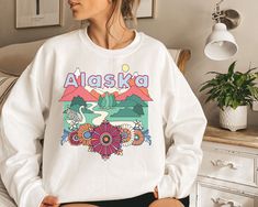 "I'm able to customize some of my items with text for your family trip, special occasion, etc. If you'd like to learn more please message me before ordering! Thank you, Ben **Please double check the size chart below prior to ordering** This Alaska sweatshirt has a loose unisex fit for a comfortable feel, is made of 50% Cotton/50% Polyester and comes in a variety of colors. You will love wearing this crewneck Alaska sweatshirt, with its soft and comfortable feel. Size Chart: Small: Width 20\" Len Montana Sweatshirt, Mountain Sweater, Colorado Sweatshirt, Montana Style, Colorado Style, California Sweatshirt, Colorado Mountain, Boulder Colorado, Jackson Hole