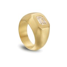 a gold ring with a diamond in the center