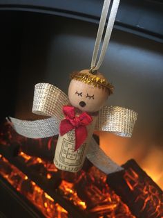 a christmas ornament hanging from a fire place