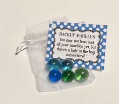 three marbles are in a bag with a label on the side that says backup marbles you may not have lost all your marbles yet but there's a hole in the bag somewhere