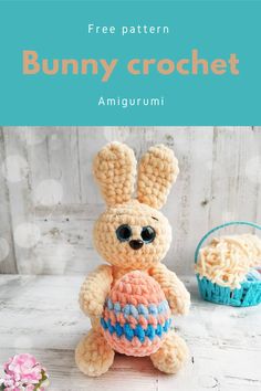 a crocheted bunny holding an egg with the words free pattern in front of it