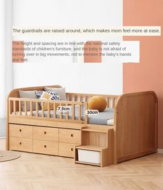 a baby crib with drawers in front of it and a wall behind it that says, the guardrails are raised around which makes mom feed more at ease