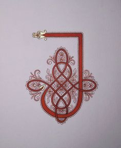 an intricately designed red and white wall hanging on the side of a bathroom door