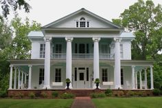 a large white house with columns on the front