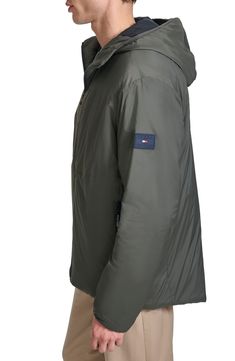 Stay warm and dry in this lightweight nylon rain jacket constructed with a fixed hood and secure zip pockets. 30" length Front zip closure Fixed hood Chest zip pocket; front zip pockets Lined, with 100% polyester fill 100% nylon Machine wash, tumble dry Imported Outdoor Nylon Windbreaker With Zipper Closure, Nylon Parka With Zipper Closure For Cold Weather, Cold Weather Nylon Raincoat With Detachable Hood, Nylon Windbreaker With Zipper For Outdoor Activities, Nylon Raincoat With Detachable Hood For Cold Weather, Hooded Windbreaker With Zip Fly For Outdoor Activities, Hooded Nylon Parka For Rainy Weather, Nylon Hooded Parka For Rainy Weather, Waterproof Nylon Hooded Jacket For Cold Weather