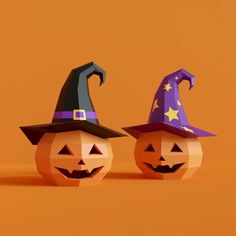 two halloween pumpkins with witches hats on them