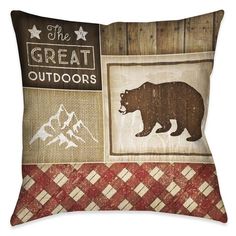 the great outdoorss pillow is shown with an image of a bear and mountains on it