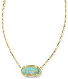 a gold necklace with a green stone in the center and a chain around it, on a white background