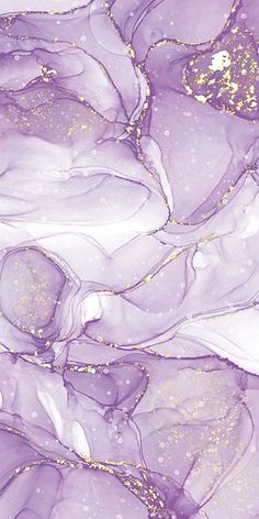 an abstract painting with gold flecks on purple and white paper, as well as glitter