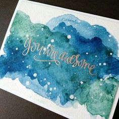 a watercolor card with the words you're awesome in gold lettering on it