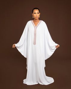 Beautiful Hand Embroidery Kaftan Dress.  This stunning kaftan has an embroidery added on the neckline. Very elegant and easy to wear. Elegant White V-neck Thobe, White V-neck Abaya, White V-neck Maxi Dress For Eid, White Eid Dresses With Embroidered Border, Elegant White V-neck Abaya, Modest Long Embroidered Kaftan, Maxi Length Thobe For Eid, Traditional White V-neck Thobe, Modest Dabka Kaftan In Maxi Length