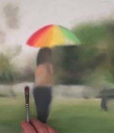 a person holding an umbrella in their hand