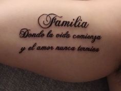 a woman with a tattoo on her arm that reads, family and dance la vita coming y'el amer nuece termina