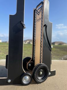 a pair of black and gold skates sitting next to each other on the ground