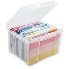 a plastic storage box filled with lots of colorful papers