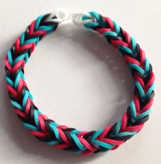 a bracelet made out of two different colored braids