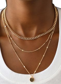 Dainty Gold Layered Charm Necklaces, Gold Layered Charm Necklace Choker, Trendy Layered Gold Jewelry, Trendy Gold Layered Jewelry, Dainty Layered Gold Chain Necklace, Trendy Gold Plated Delicate Chain Layered Necklace, Trendy Gold Charm Necklaces For Layering, Trendy Gold Layered Necklace With Figaro Chain, Trendy Gold Plated Layered Necklace With Adjustable Chain