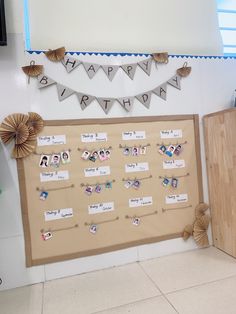 a bulletin board with pictures and decorations on it in a room that looks like a happy birthday